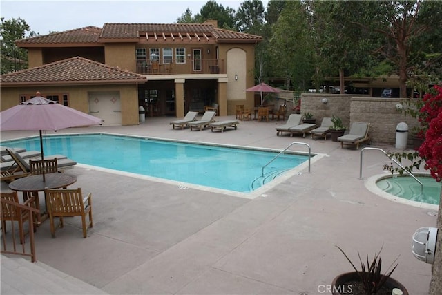 community pool featuring a patio