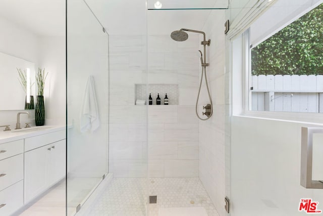 bathroom with vanity and walk in shower