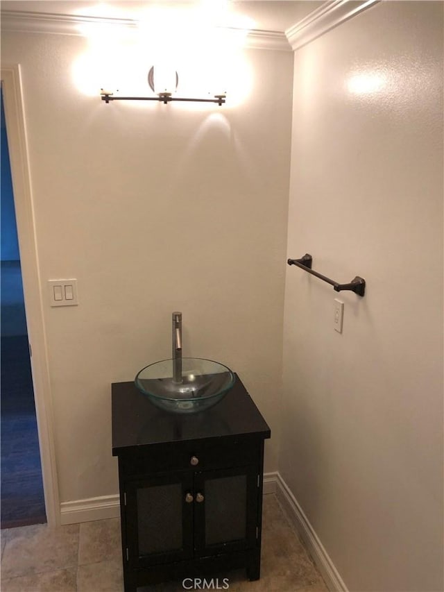 bathroom with vanity, tile patterned floors, and crown molding