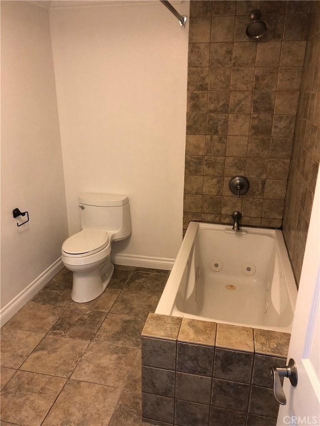 bathroom featuring toilet and tiled shower / bath