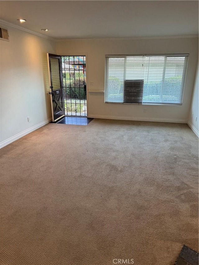 unfurnished living room with carpet floors and crown molding