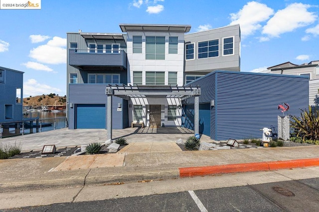 view of front facade featuring a water view and a garage