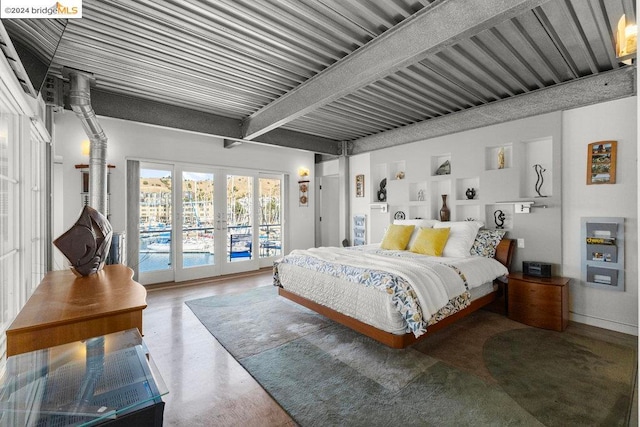 bedroom with access to outside, beam ceiling, concrete floors, and french doors