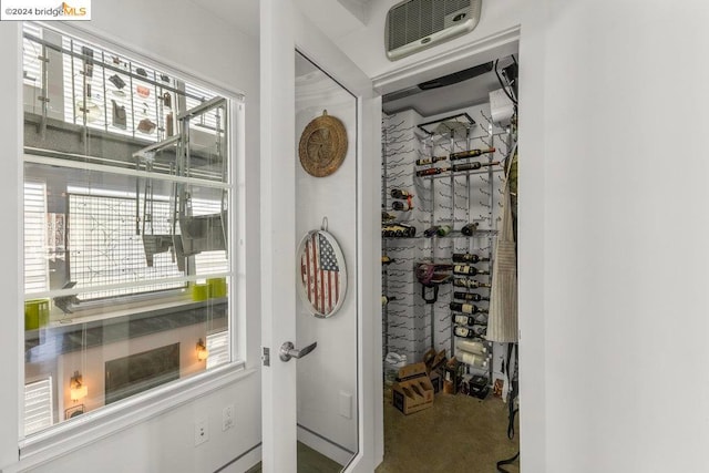 interior space featuring plenty of natural light and carpet flooring