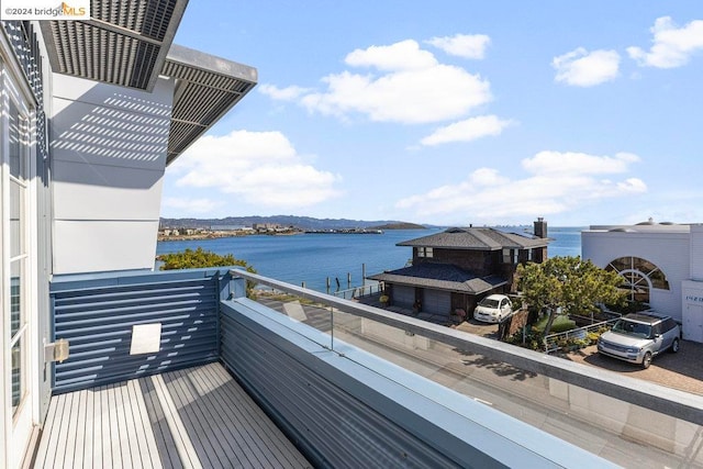 balcony featuring a water view