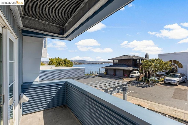 balcony featuring a water view