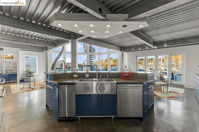 kitchen featuring french doors, dishwasher, a large island with sink, and sink