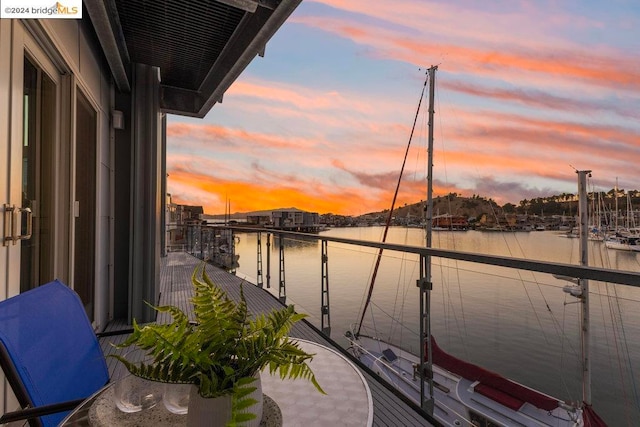 balcony at dusk with a water view