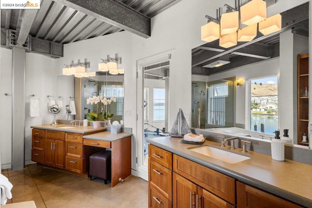 bathroom featuring vanity, beam ceiling, a notable chandelier, and a water view