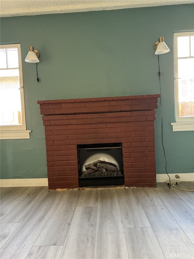 details featuring a fireplace and hardwood / wood-style flooring