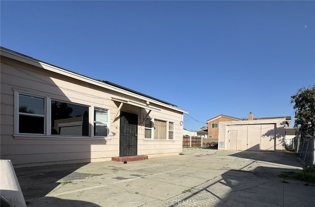 view of patio with a storage shed