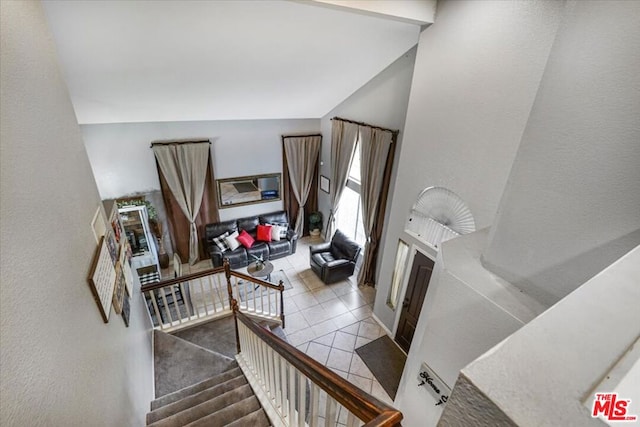 stairway featuring tile patterned flooring