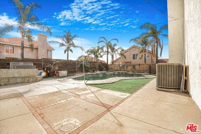 exterior space with a fenced in pool, a patio, and central air condition unit