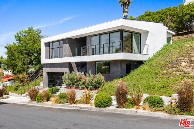 contemporary home featuring a balcony