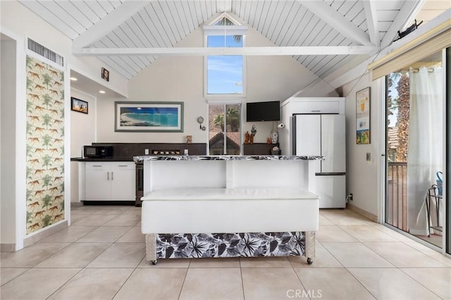 tiled living room with lofted ceiling with beams and wooden ceiling