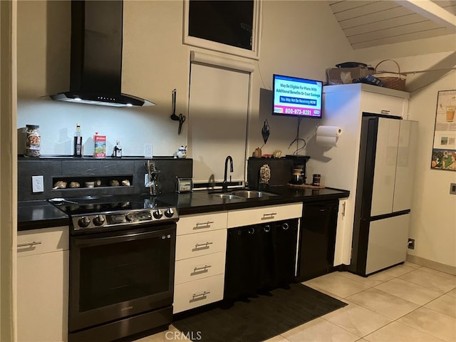 kitchen featuring white cabinetry, wall chimney range hood, and stainless steel range