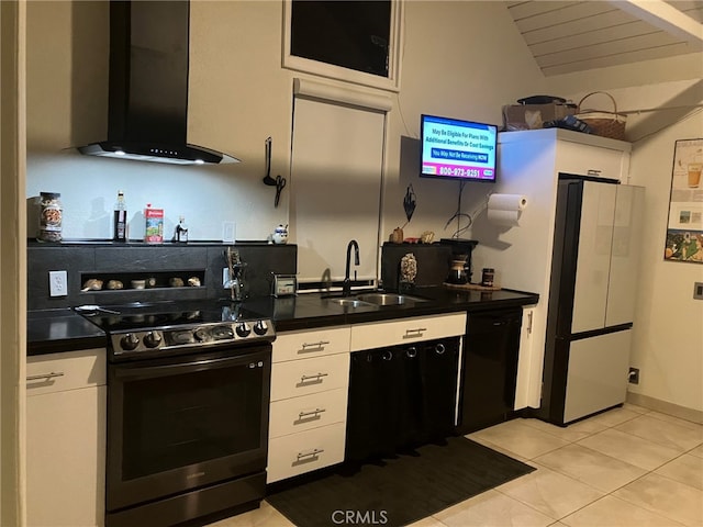 kitchen with white cabinetry, wall chimney range hood, and stainless steel stove