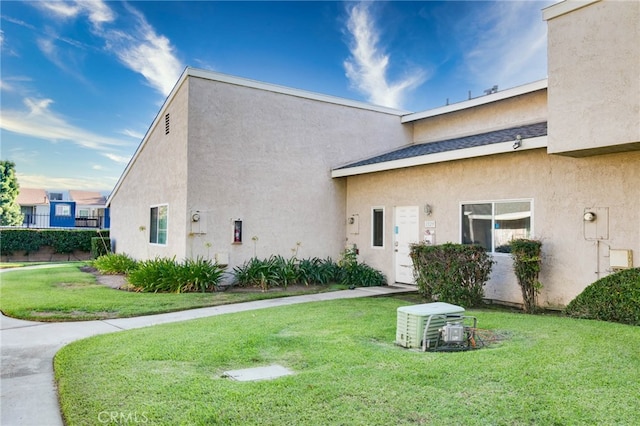 rear view of house with a yard