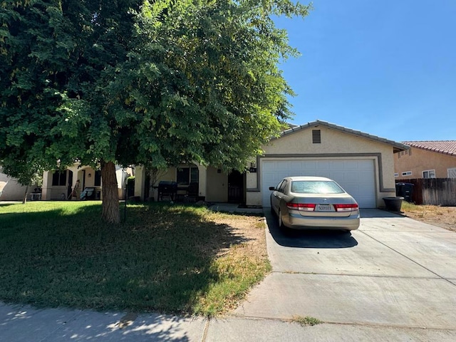 view of front facade featuring a garage and a front lawn