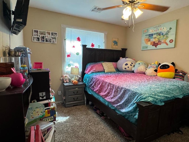 bedroom featuring ceiling fan and carpet