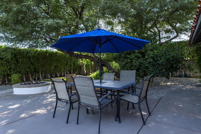 view of patio / terrace featuring an outdoor fire pit