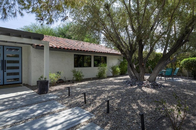 view of side of home featuring a patio area