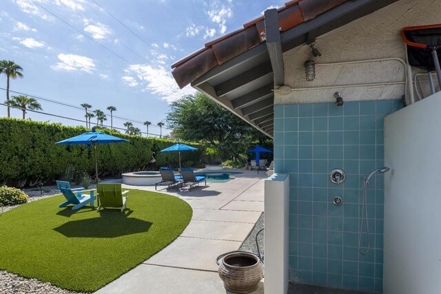 view of patio / terrace featuring a fenced in pool