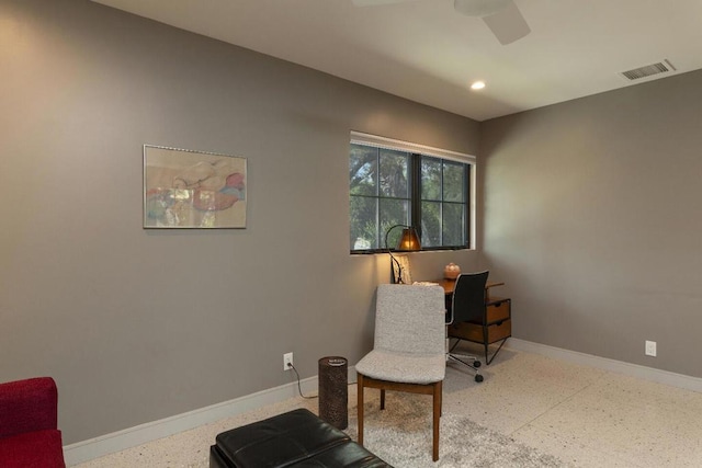 living area with ceiling fan