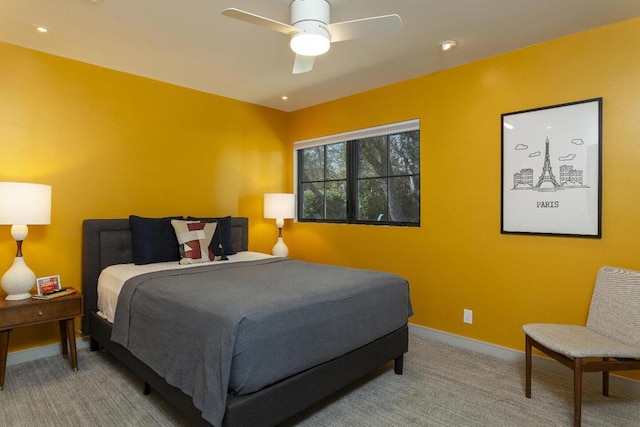 bedroom with ceiling fan and carpet