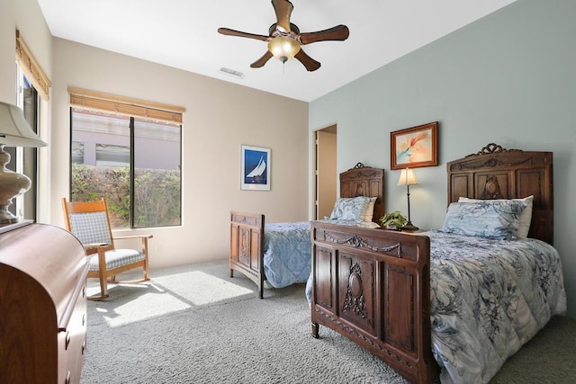 bedroom featuring ceiling fan and light carpet