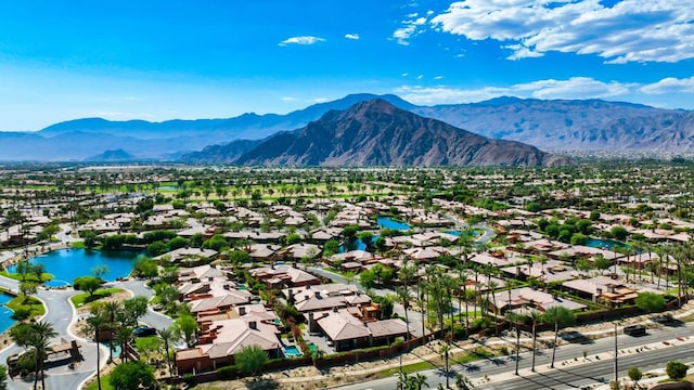 birds eye view of property featuring a water and mountain view