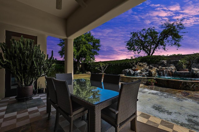 patio terrace at dusk with ceiling fan