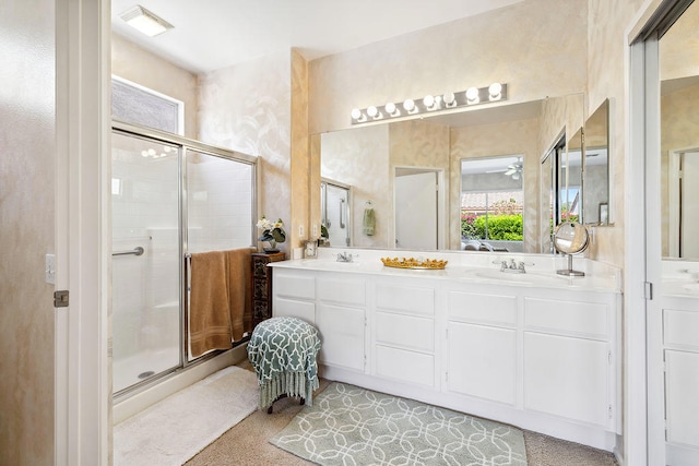 bathroom featuring vanity and a shower with shower door