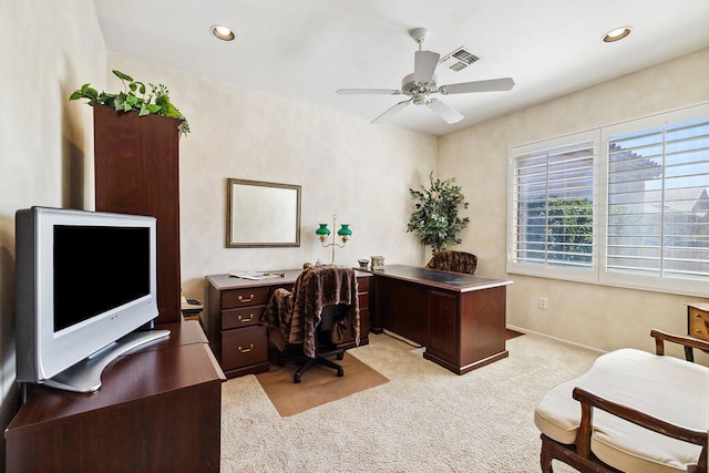 home office featuring light colored carpet and ceiling fan