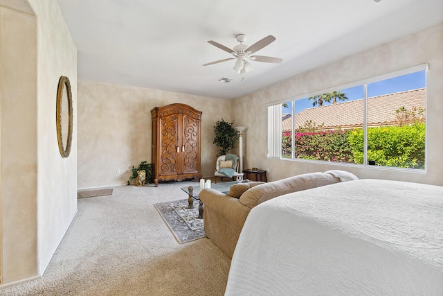 bedroom featuring ceiling fan and light colored carpet