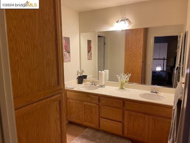 bathroom with tile patterned flooring and vanity