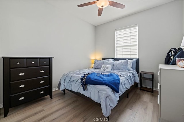 bedroom featuring ceiling fan and light hardwood / wood-style flooring