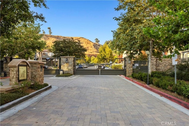 view of gate featuring a mountain view