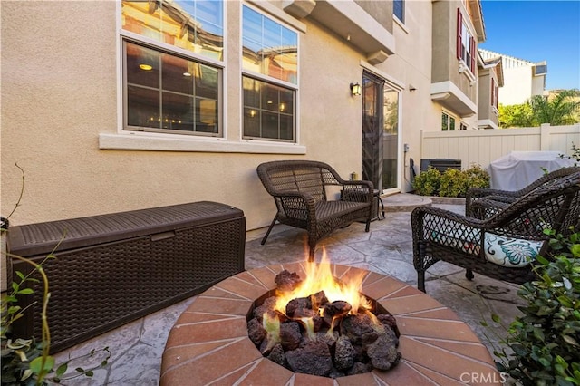 view of patio / terrace with area for grilling and a fire pit