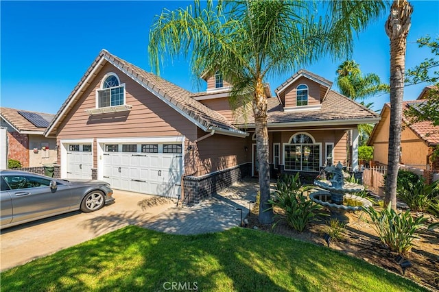 view of front of property with a front lawn and a garage