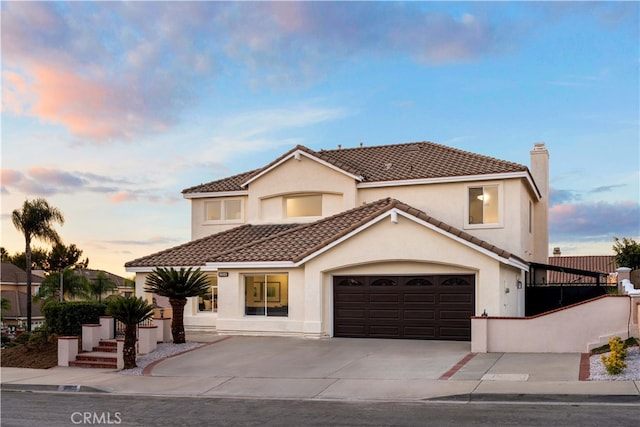 mediterranean / spanish-style house featuring a garage