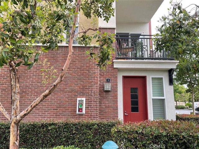 view of property exterior featuring a balcony