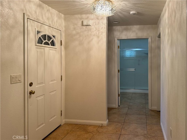 hallway featuring tile patterned flooring