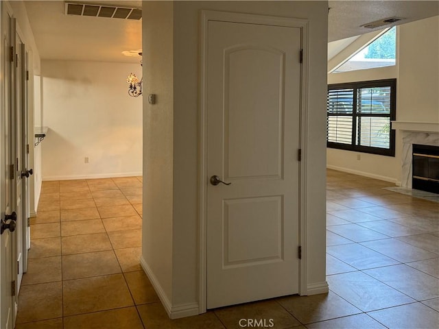 hallway featuring light tile patterned floors