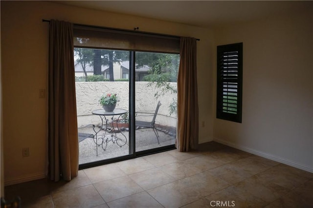 doorway featuring light tile patterned flooring