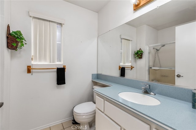 bathroom with vanity, a shower with shower door, toilet, and tile patterned flooring