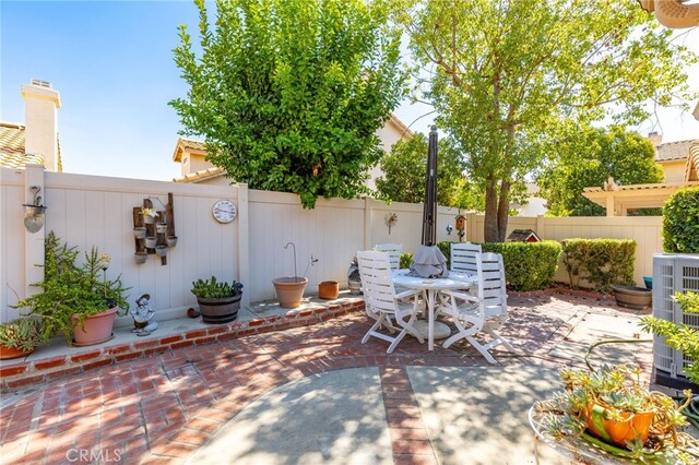 view of patio / terrace with outdoor dining area and a fenced backyard