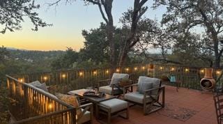 view of patio terrace at dusk