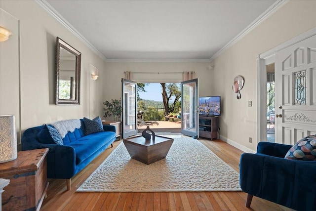 living room featuring crown molding and light wood-type flooring