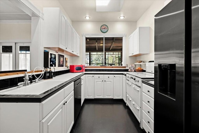 kitchen featuring sink, dishwasher, kitchen peninsula, white cabinets, and stainless steel fridge with ice dispenser